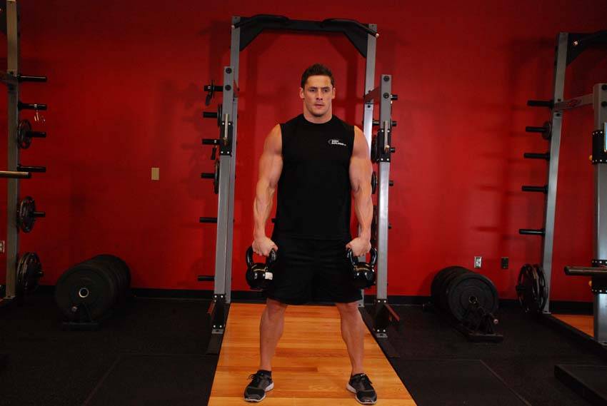 Démonstration de l’exercice : Snatch à deux kettlebells