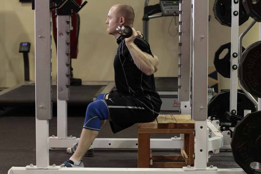 Démonstration de l’exercice : Good morning assis à la barre