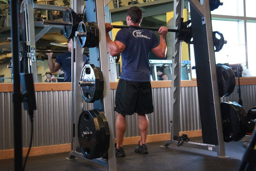Démonstration de l’exercice : Squat au Smith machine