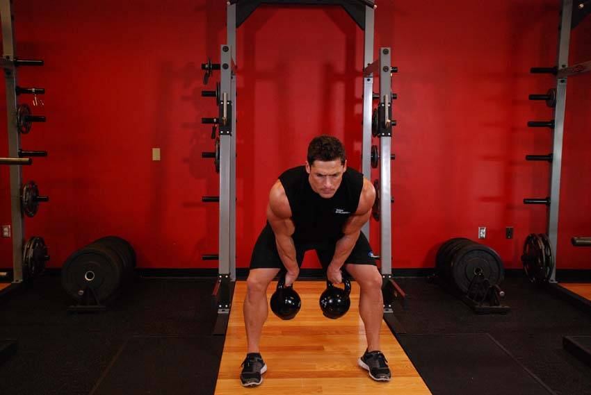 Démonstration de l’exercice : Clean à deux kettlebells